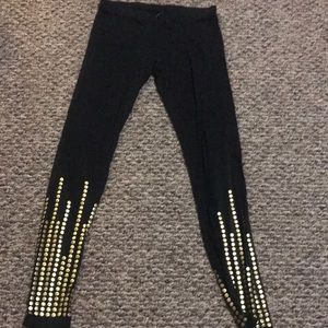 Tart Leggings with gold studs.